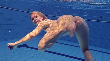 Underwater sex in the pool at the nudist resort